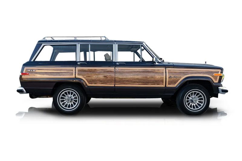 An incredible side shot photo of aJeep Grand Wagoneer that you should buy.
