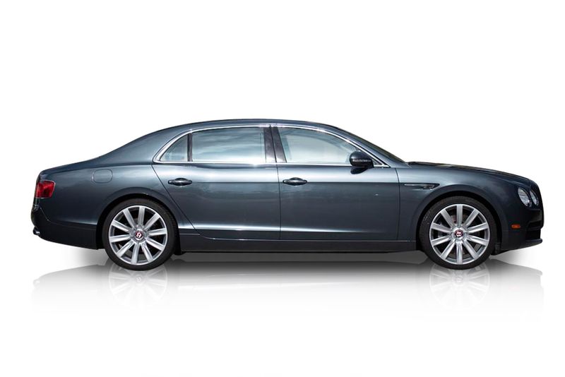 An incredible side shot photo of aBentley Flying Spur that you should buy.