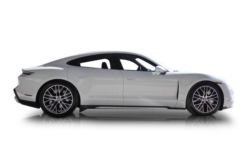 An incredible side shot photo of aPorsche Taycan that you should buy.