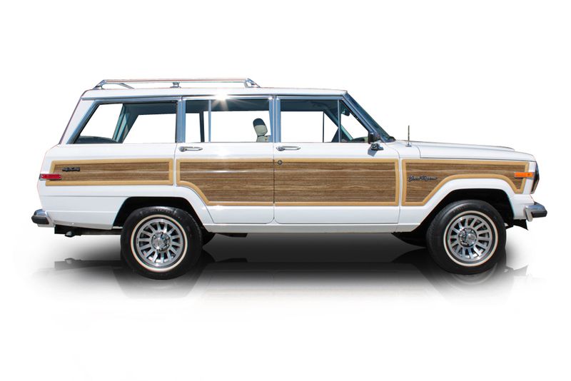 An incredible side shot photo of aJeep Grand Wagoneer that you should buy.