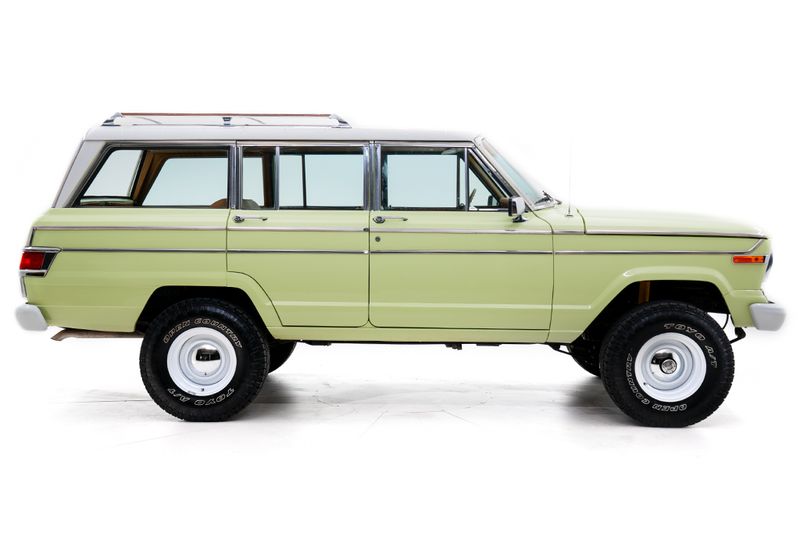 An incredible side shot photo of aJeep Wagoneer that you should buy.