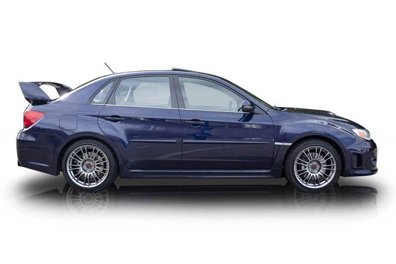 An incredible side shot photo of aSubaru Impreza that you should buy.