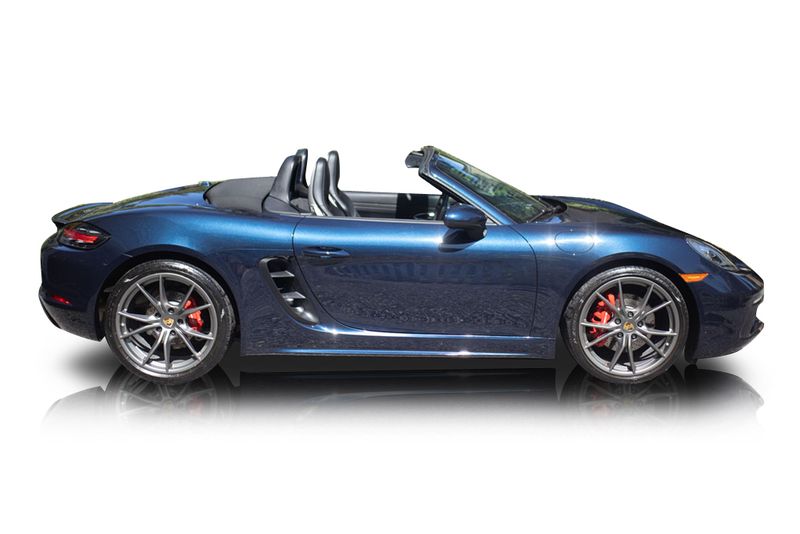 An incredible side shot photo of aPorsche Boxster that you should buy.