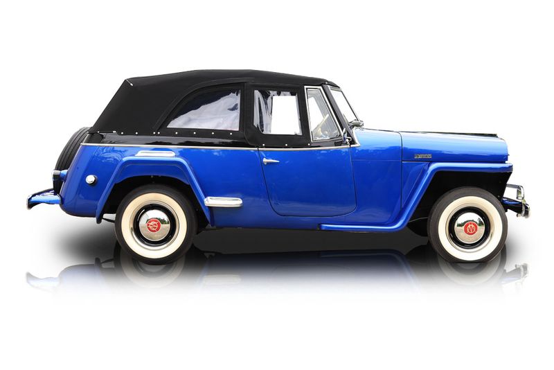 An incredible side shot photo of aWillys Jeepster that you should buy.