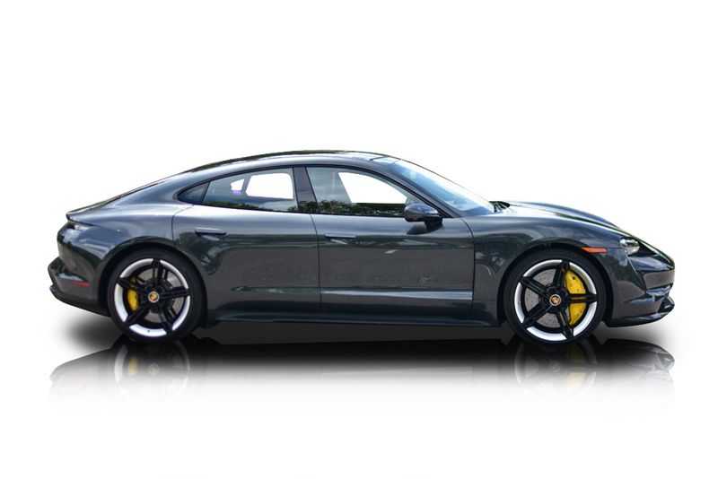 An incredible side shot photo of aPorsche Taycan that you should buy.