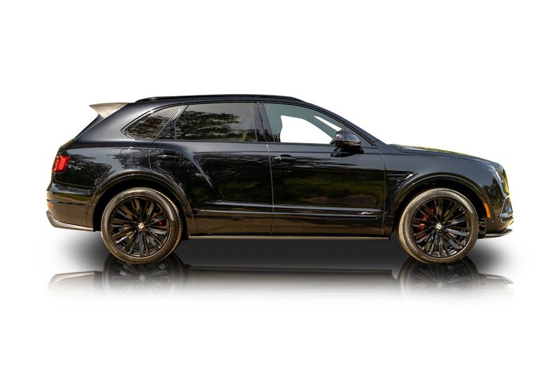 An incredible side shot photo of aBentley Bentayga that you should buy.