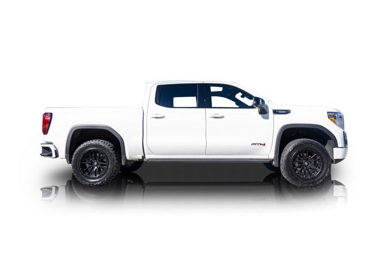 An incredible side shot photo of aGMC Sierra 1500 that you should buy.