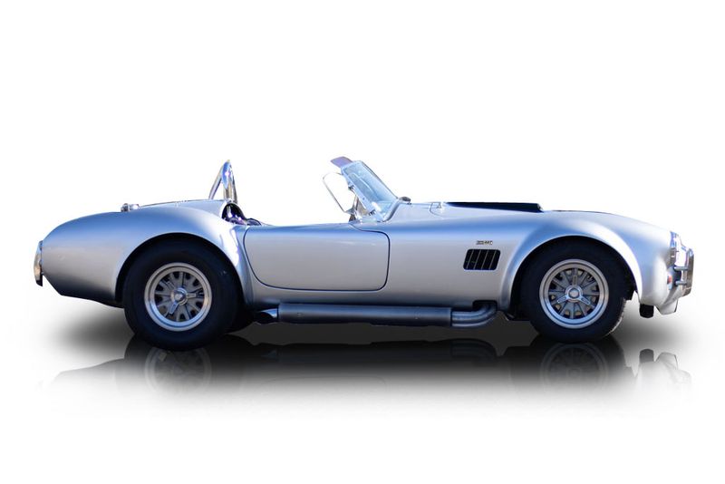 An incredible side shot photo of aShelby Cobra that you should buy.
