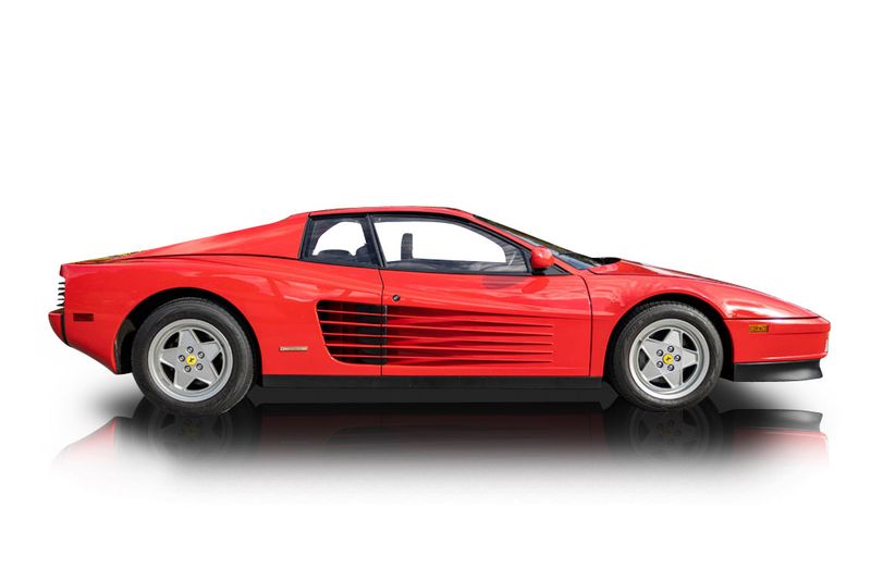 An incredible side shot photo of aFerrari Testarossa that you should buy.