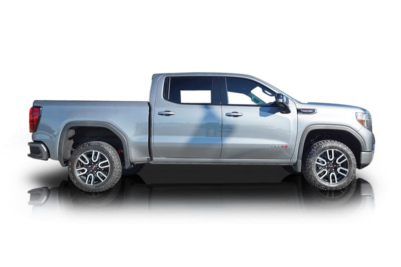 An incredible side shot photo of aGMC Sierra 1500 that you should buy.