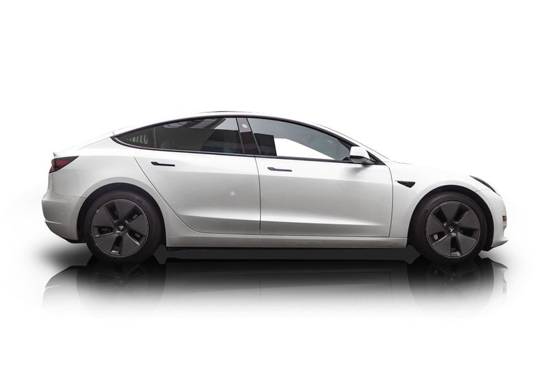 An incredible side shot photo of aTesla Model 3 that you should buy.