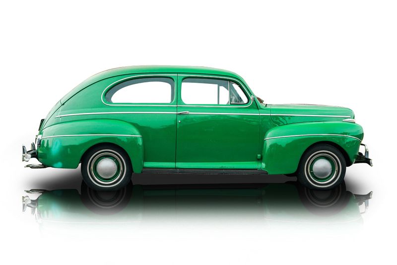 An incredible side shot photo of aFord Deluxe that you should buy.