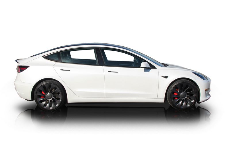 An incredible side shot photo of aTesla Model 3 that you should buy.