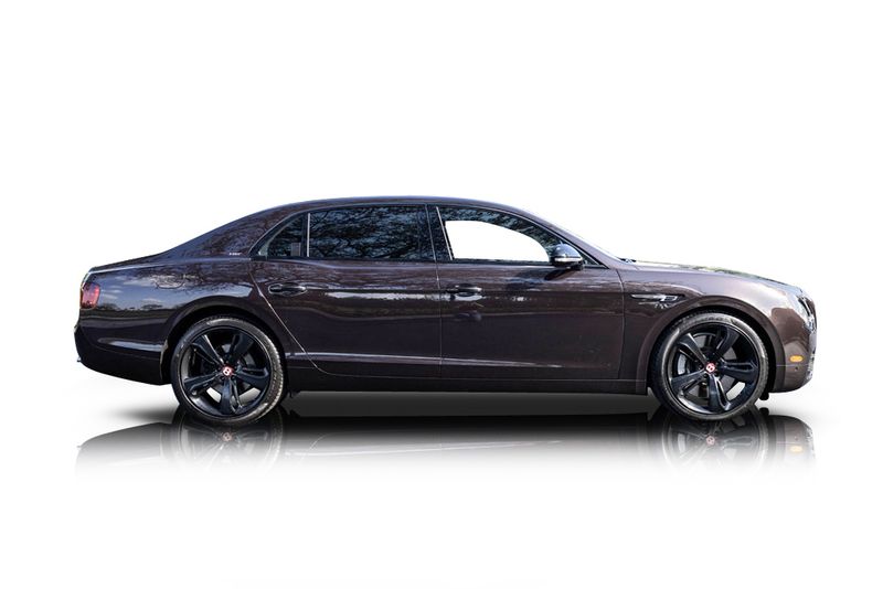 An incredible side shot photo of aBentley Flying Spur that you should buy.