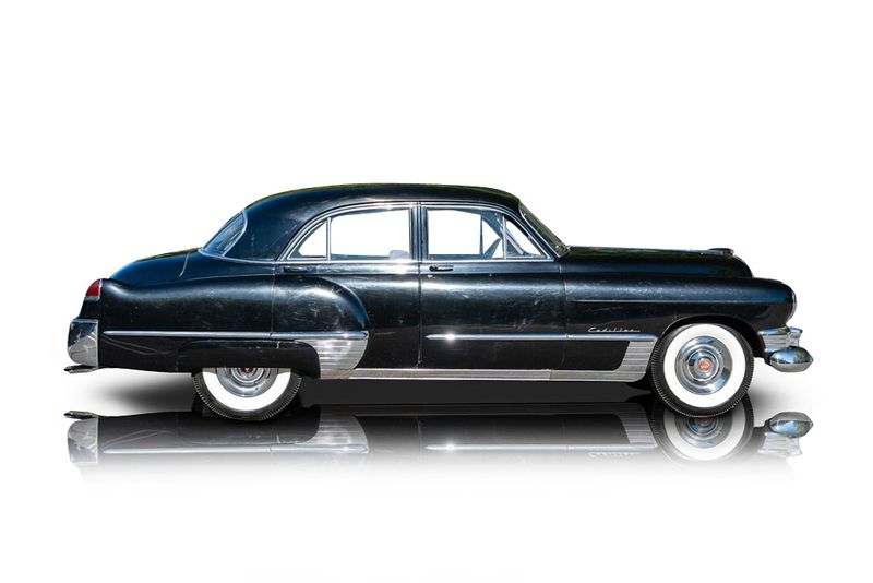 An incredible side shot photo of aCadillac Series 62 that you should buy.