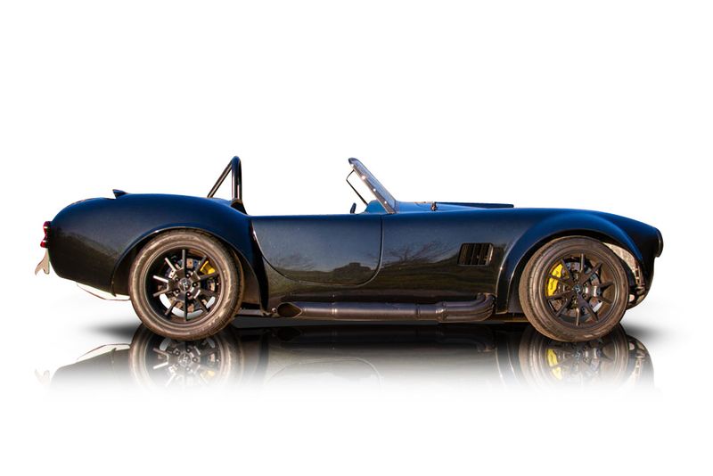 An incredible side shot photo of aShelby Cobra that you should buy.