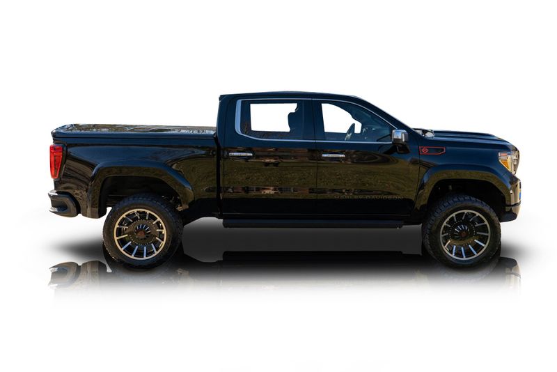 An incredible side shot photo of aGMC Sierra 1500 that you should buy.