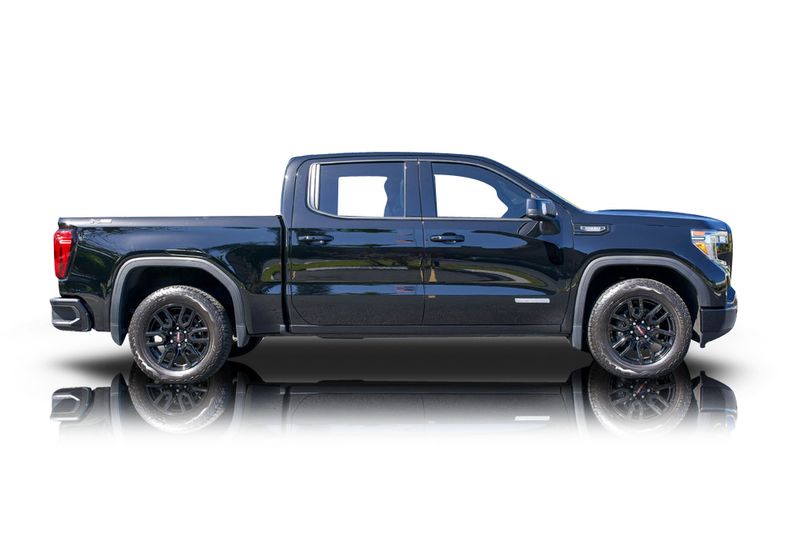 An incredible side shot photo of aGMC Sierra 1500 that you should buy.
