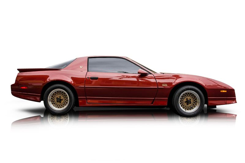 An incredible side shot photo of aPontiac Firebird that you should buy.