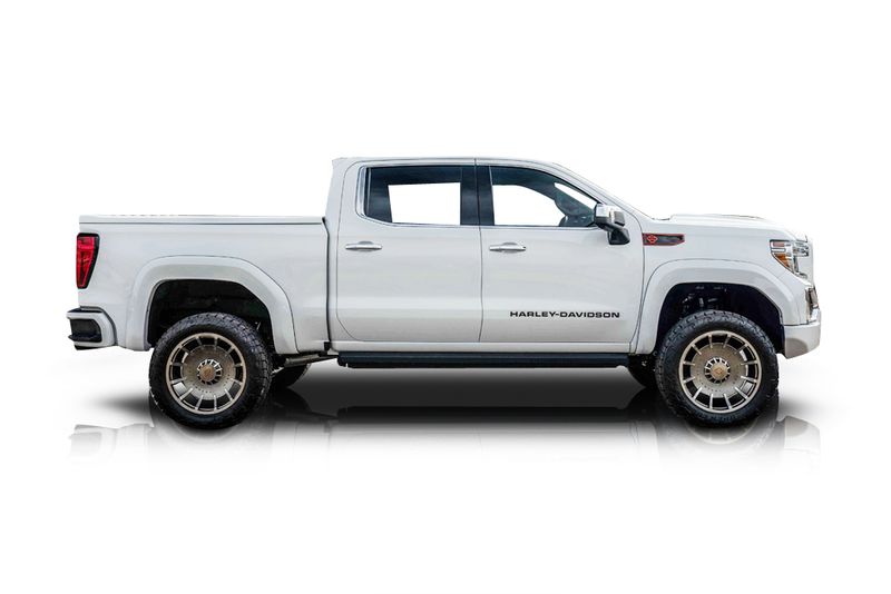 An incredible side shot photo of aGMC Sierra 1500 that you should buy.