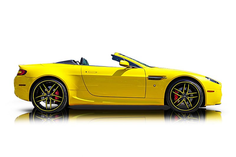 An incredible side shot photo of aAston Martin Vantage that you should buy.