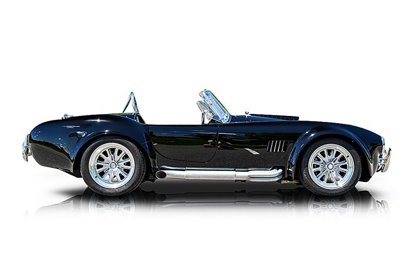 An incredible side shot photo of aShelby Cobra that you should buy.
