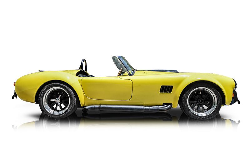 An incredible side shot photo of aShelby Cobra that you should buy.