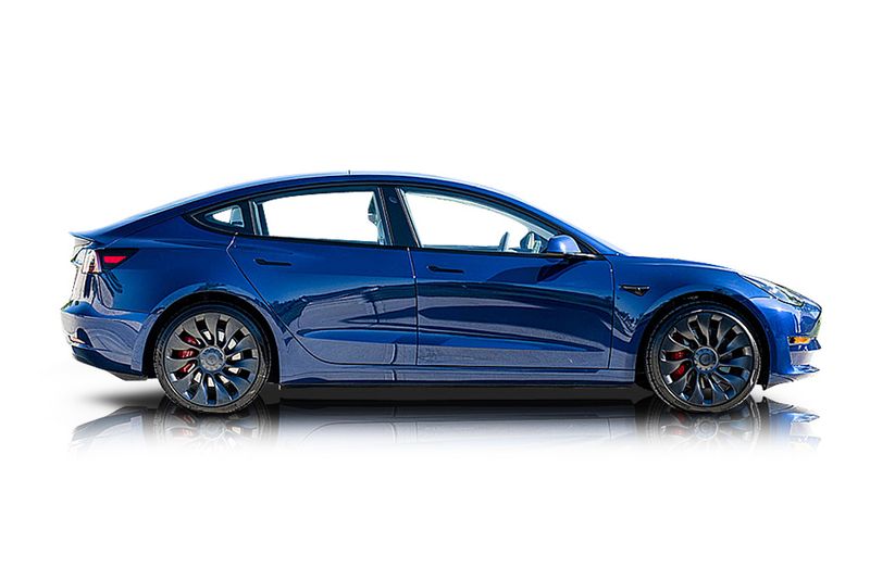 An incredible side shot photo of aTesla Model 3 that you should buy.
