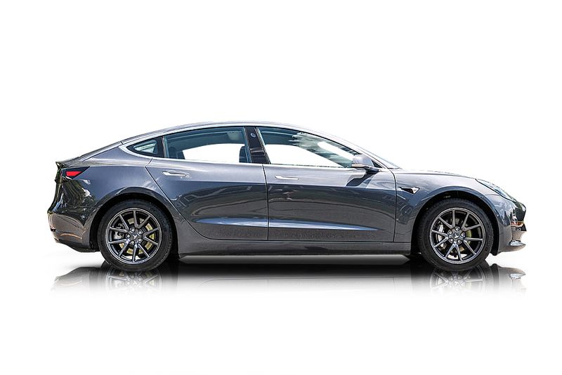 An incredible side shot photo of aTesla Model 3 that you should buy.