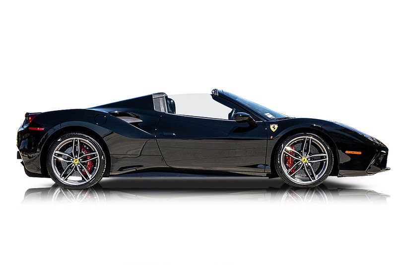An incredible side shot photo of aFerrari 488 Spider that you should buy.
