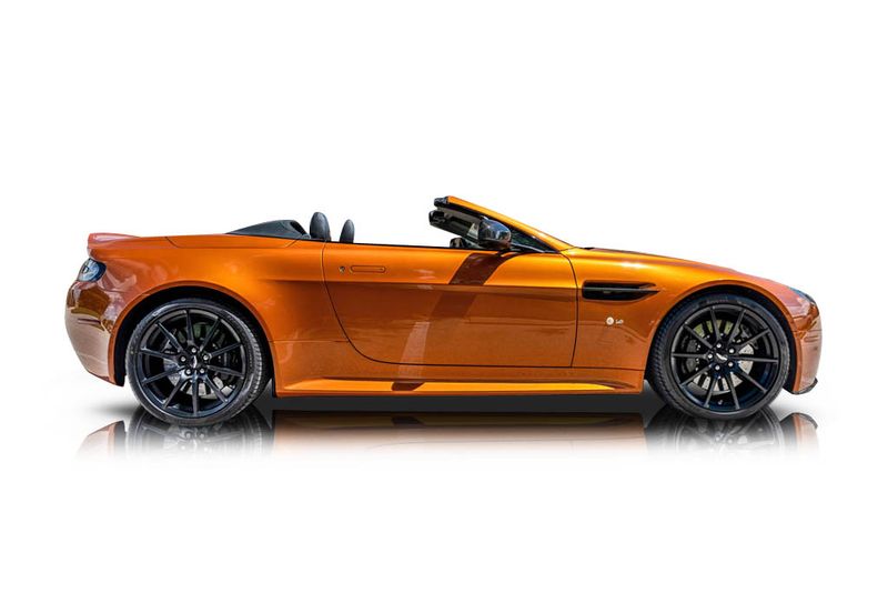 An incredible side shot photo of aAston Martin V12 Vantage that you should buy.