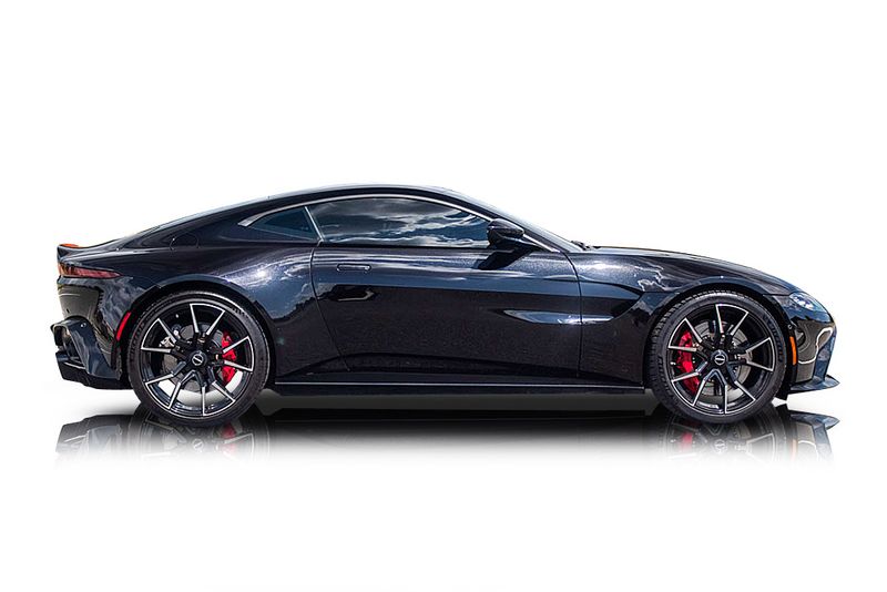 An incredible side shot photo of aAston Martin Vantage that you should buy.