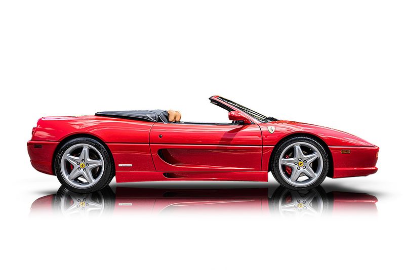 An incredible side shot photo of aFerrari F355 Spider that you should buy.