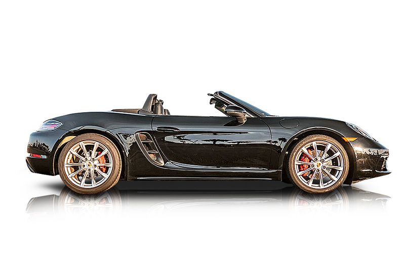 An incredible side shot photo of aPorsche Boxster that you should buy.