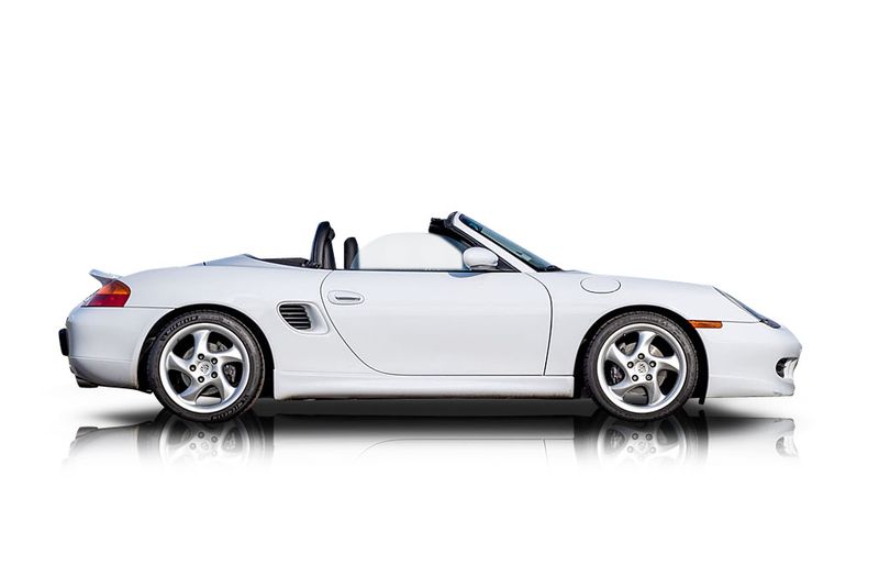 An incredible side shot photo of aPorsche Boxster that you should buy.