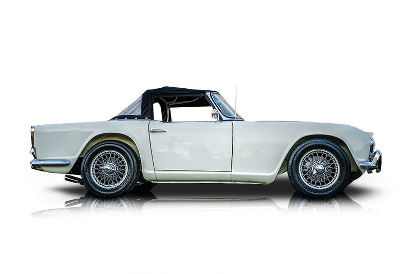 An incredible side shot photo of aTriumph TR4 that you should buy.