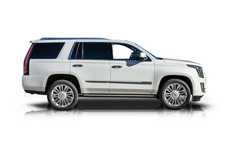 An incredible side shot photo of aCadillac Escalade that you should buy.