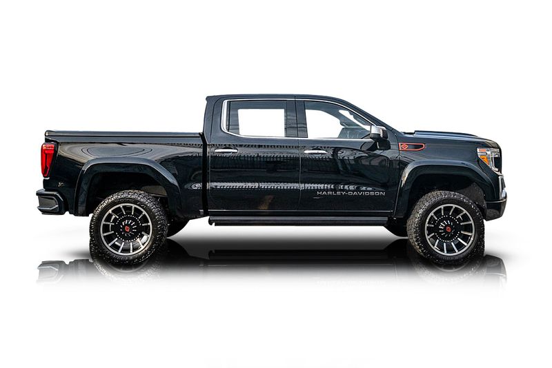 An incredible side shot photo of aGMC Sierra 1500 that you should buy.