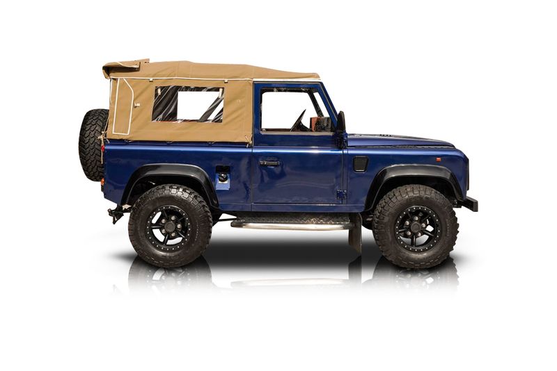 An incredible side shot photo of aLand Rover Defender 90 that you should buy.