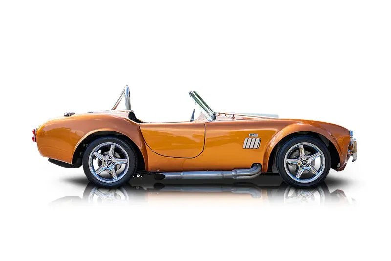 An incredible side shot photo of aShelby Cobra that you should buy.