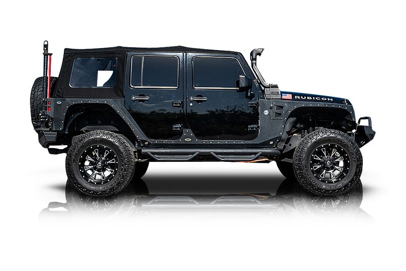 An incredible side shot photo of aJeep Wrangler that you should buy.
