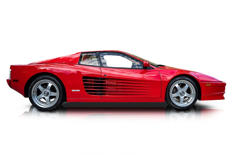 An incredible side shot photo of aFerrari Testarossa that you should buy.