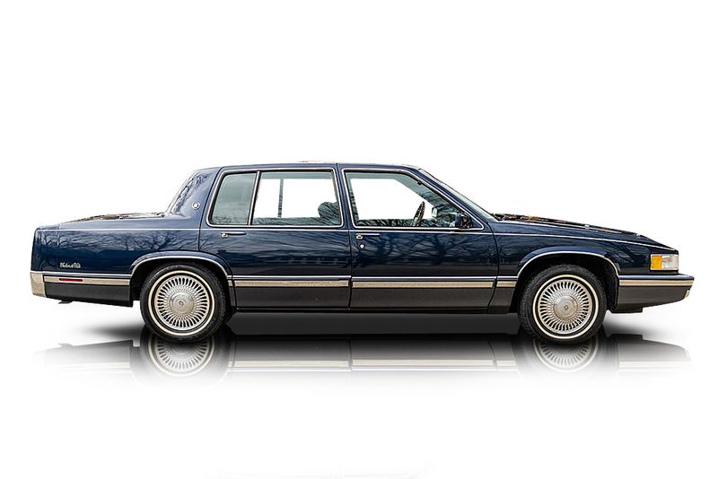 An incredible side shot photo of aCadillac DeVille that you should buy.