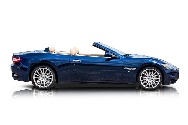 An incredible side shot photo of aMaserati GranTurismo that you should buy.