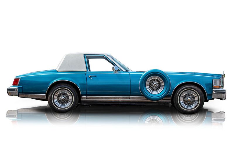 An incredible side shot photo of aCadillac Seville that you should buy.