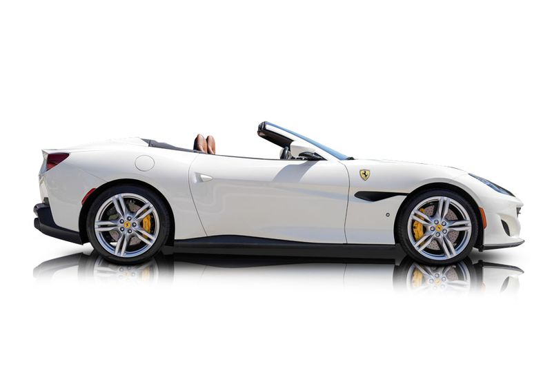 An incredible side shot photo of aFerrari Portofino that you should buy.