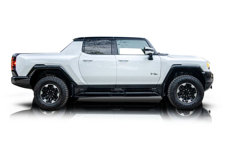 An incredible side shot photo of aGMC Hummer EV that you should buy.
