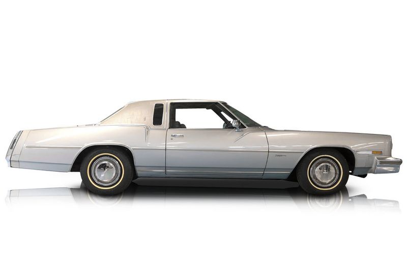 An incredible side shot photo of aOldsmobile Toronado that you should buy.
