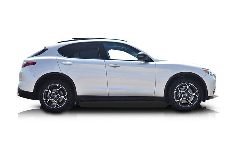 An incredible side shot photo of aAlfa Romeo Stelvio that you should buy.