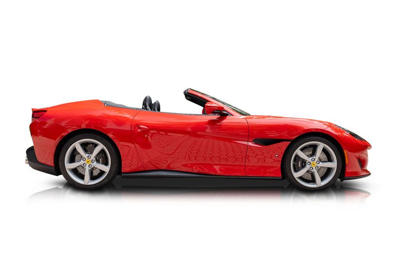 An incredible side shot photo of aFerrari Portofino that you should buy.